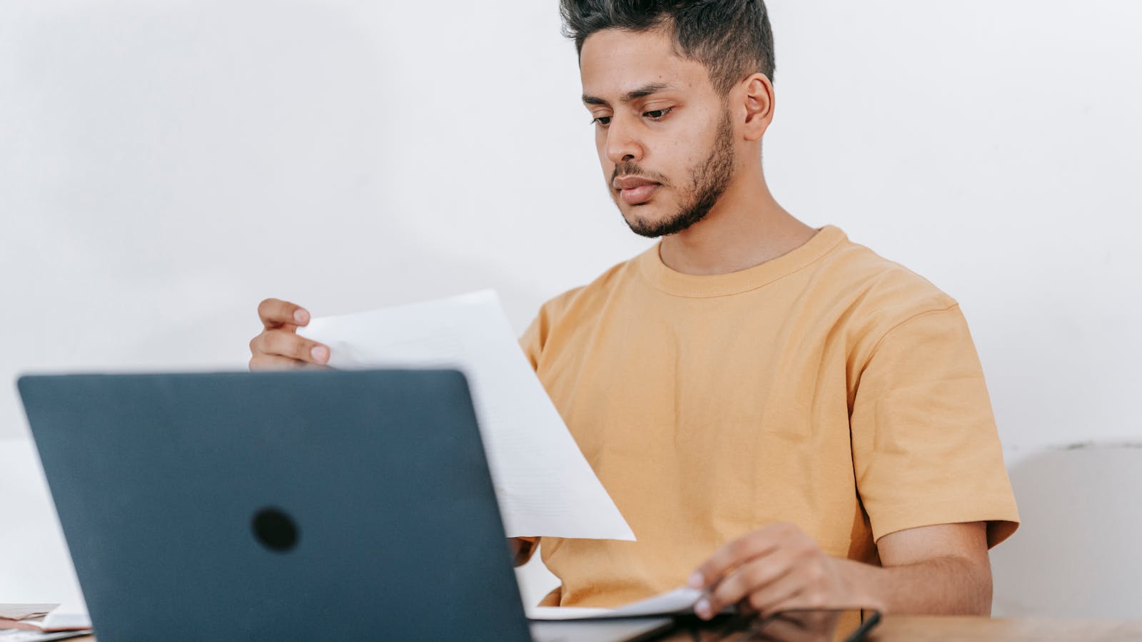 Prepared Pexels-style image showing a first-time buyer reviewing freelance proposals