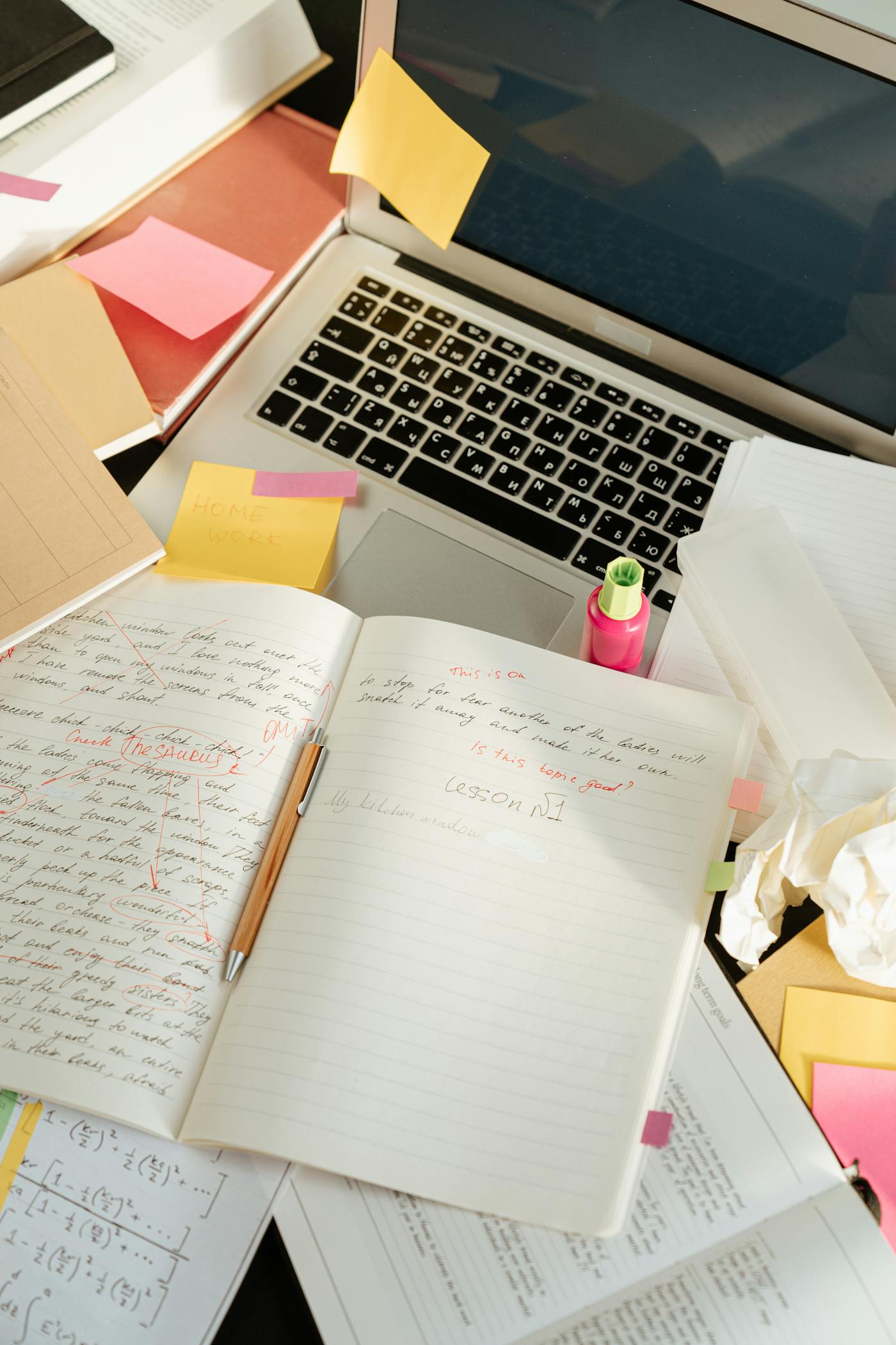 Sticky notes and workflow planning materials laid out beside a laptop for process mapping